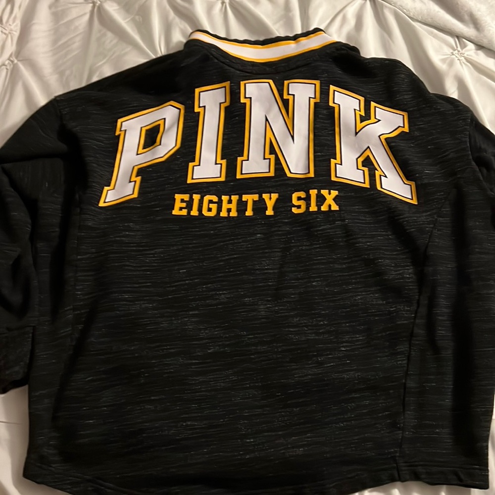 Pink sweater.